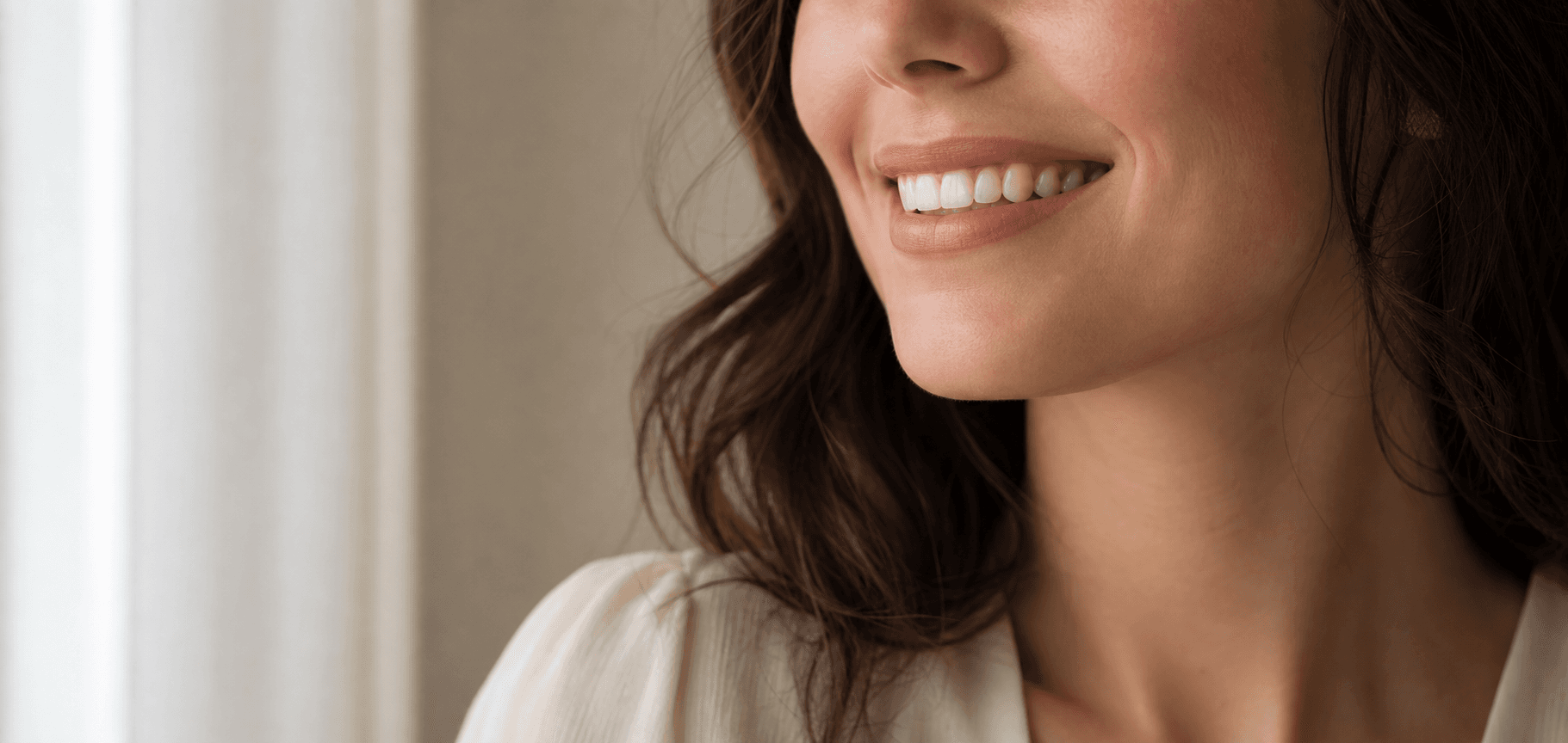 Bright, natural smile shown to illustrate professional teeth whitening results